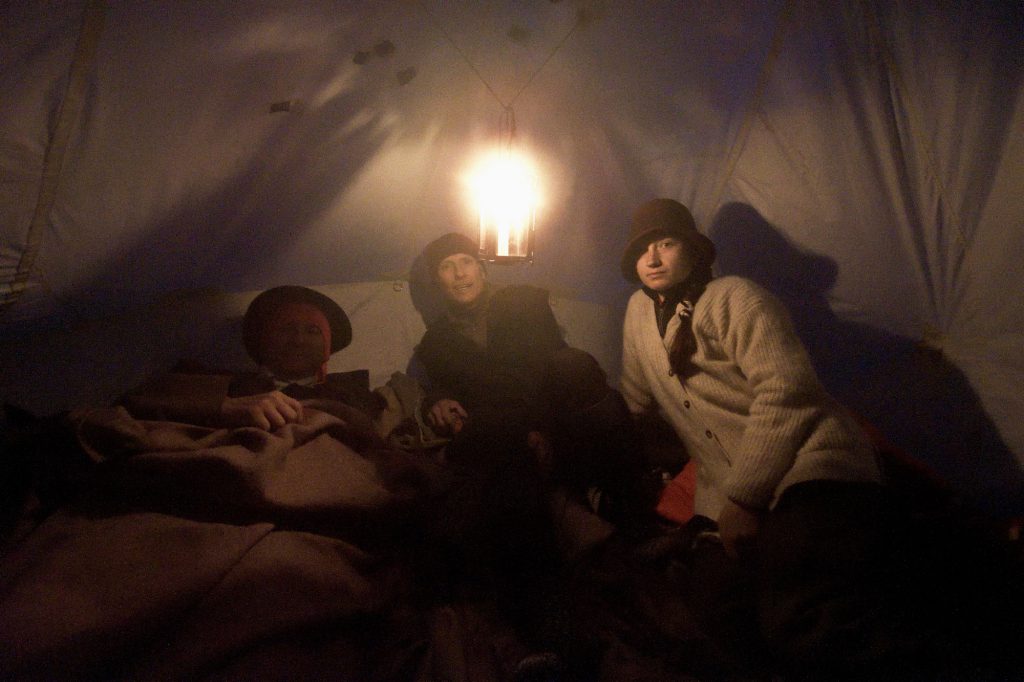 Rob LeBlanc, Garry Reiss and Natalia Danalachi settle down for a cold night before their first summit attempt