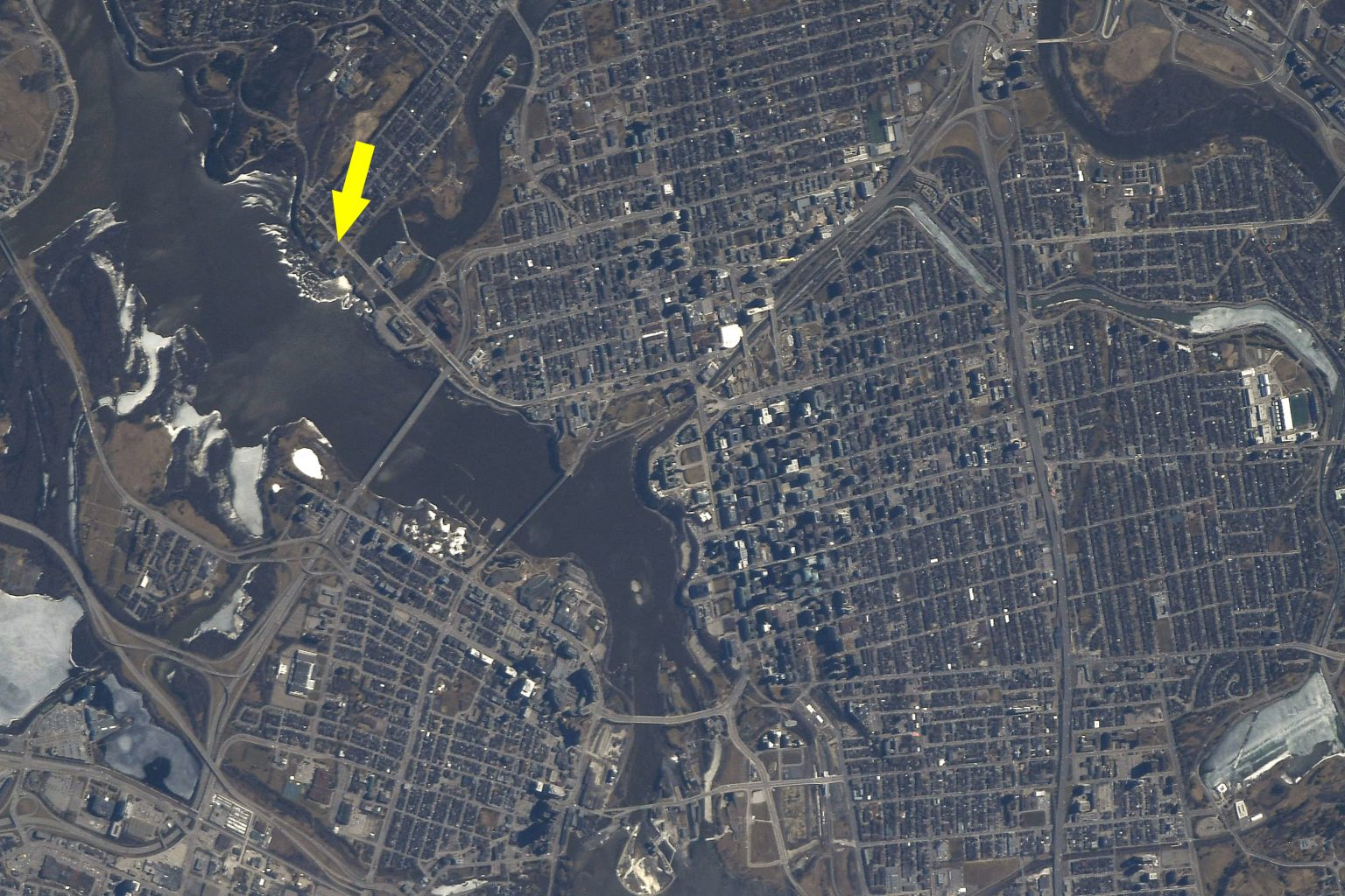 View of Ottawa from orbit with 50 Sussex Drive indicated by a yellow arrow