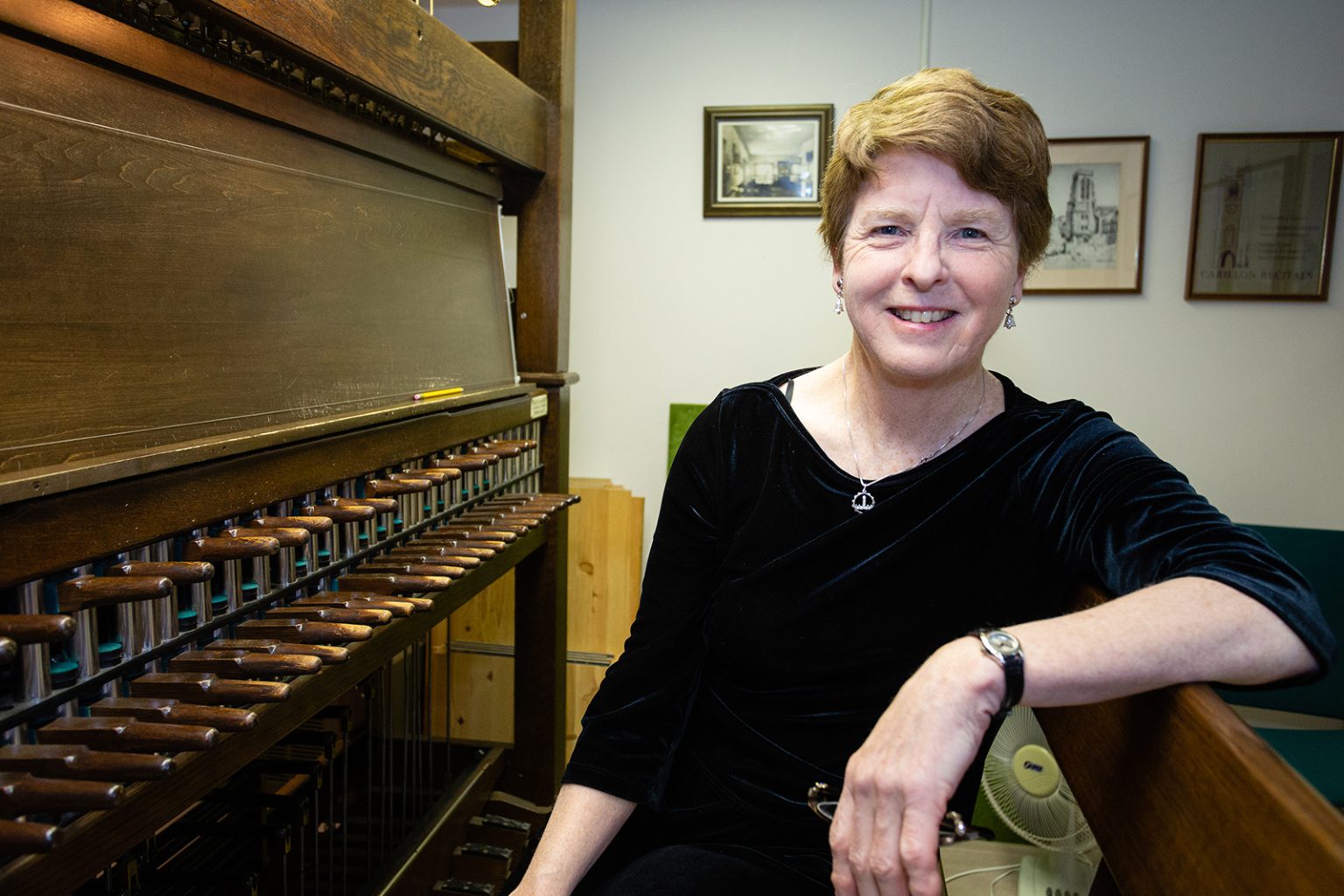 Dominion carillonneur Andrea McCrady with the practice keyboard in her office