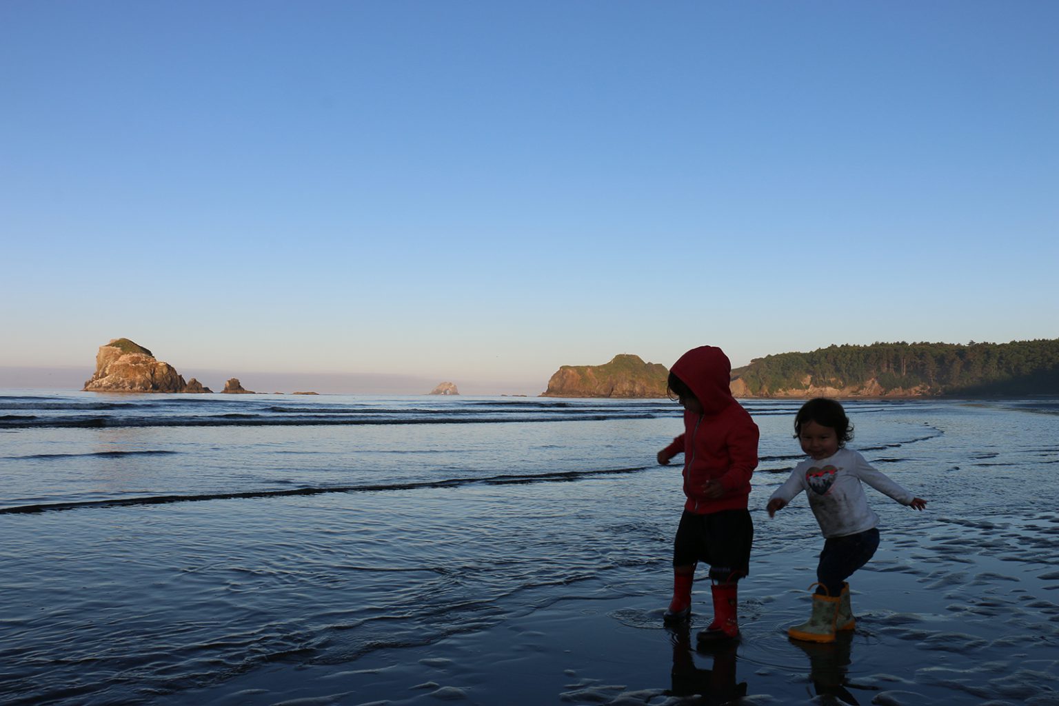 Children play on the beach below Point Grenville on the Quinault reservation.