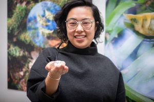 Canadian food designer Amanda Huynh shows off a piece of her exhibit, Diasporic Dumplings.