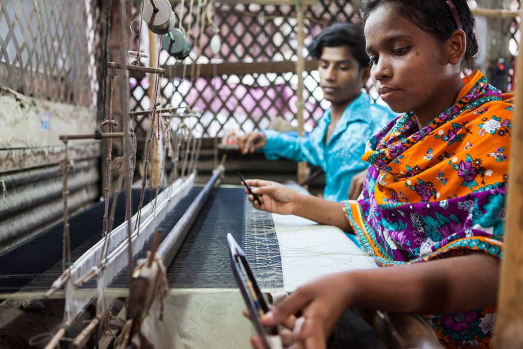 A woman weaves Jamdani fabric in Bangladesh. The fabric, which UNESCO has recognized as an item that represents the intangible cultural heritage of humanity, is one of many handicrafts on the Artisan Hub website