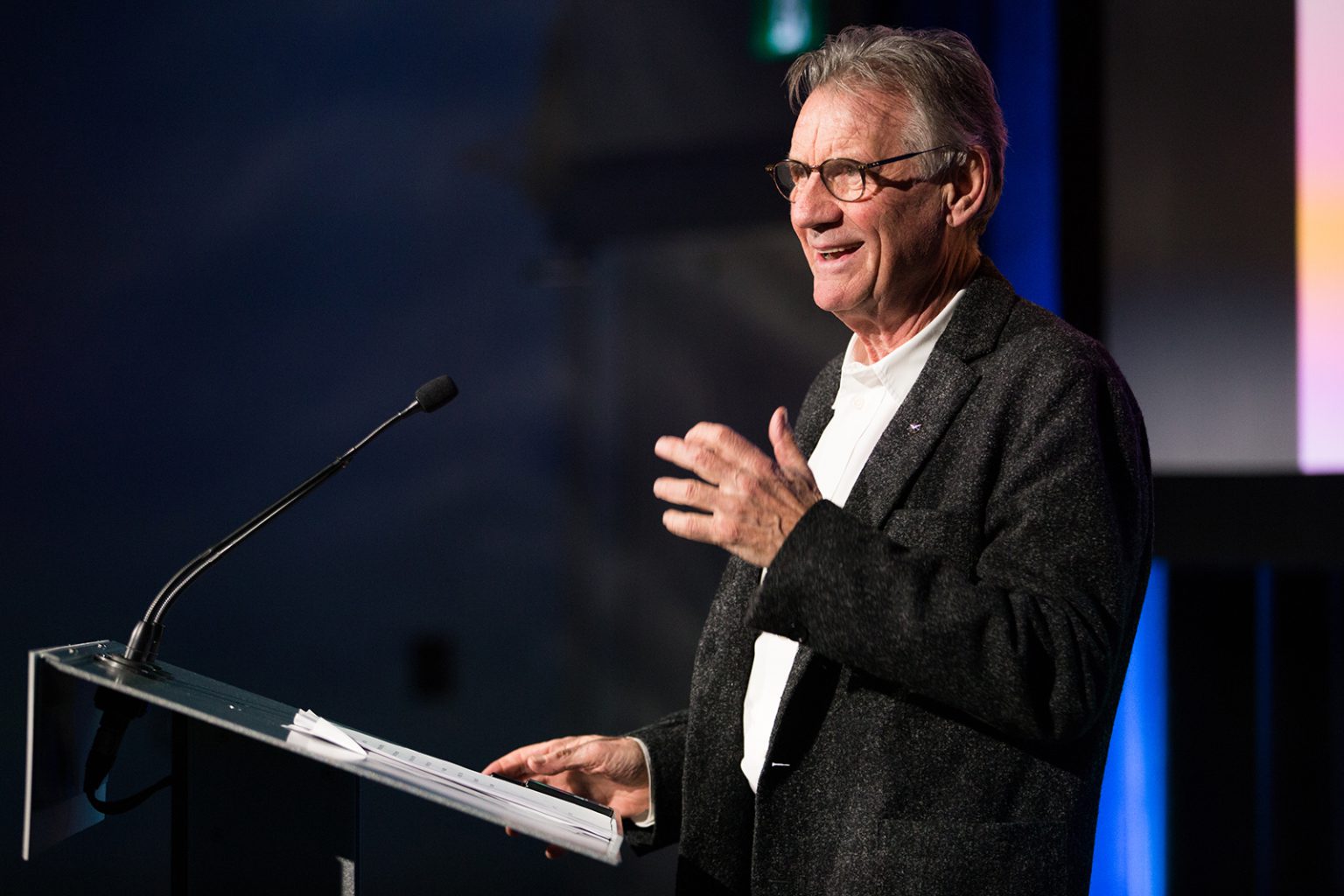 Michael Palin, of Monty Python fame, laughs while giving a talk at 50 Sussex Drive
