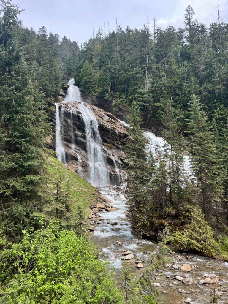 A waterfall cascades down a mountainside