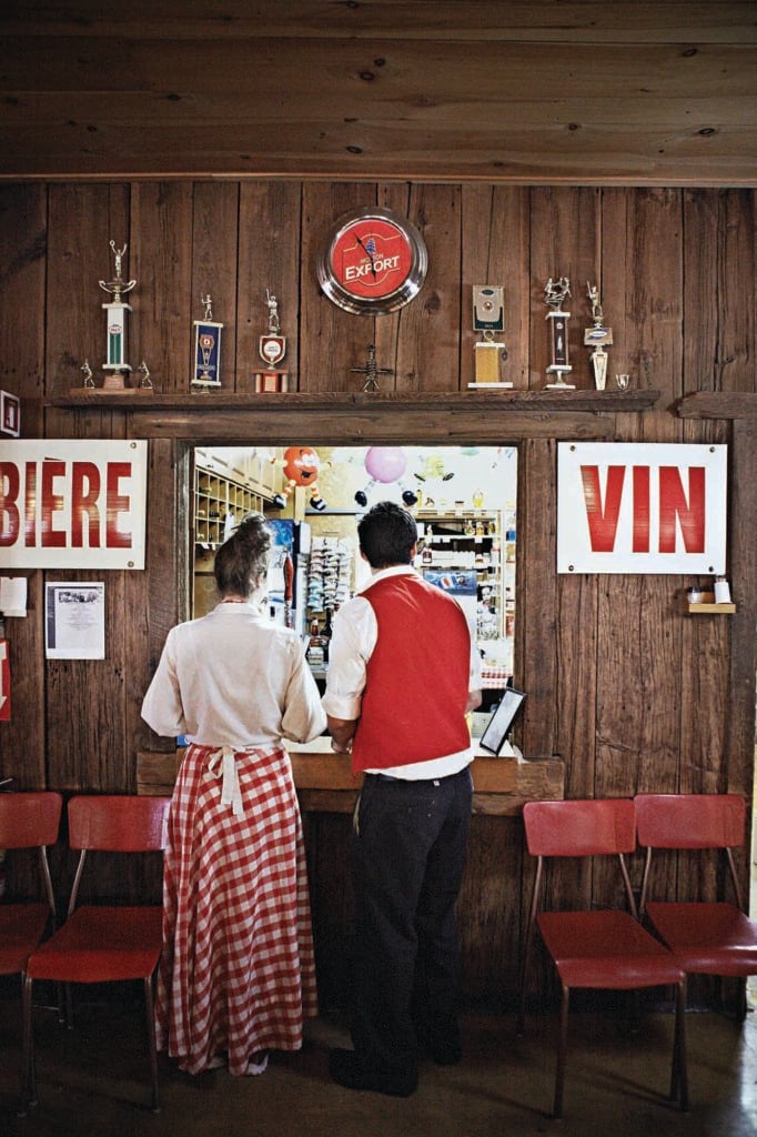 Two servers wait for their orders at a sugar shack