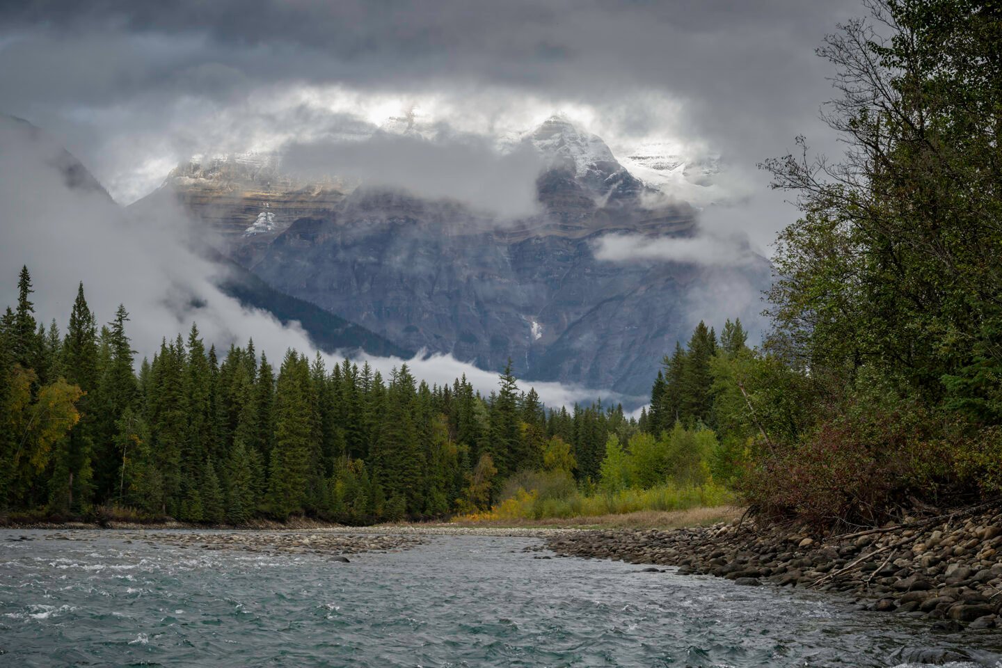 The Fraser River in front of the misty Rocky Mountains