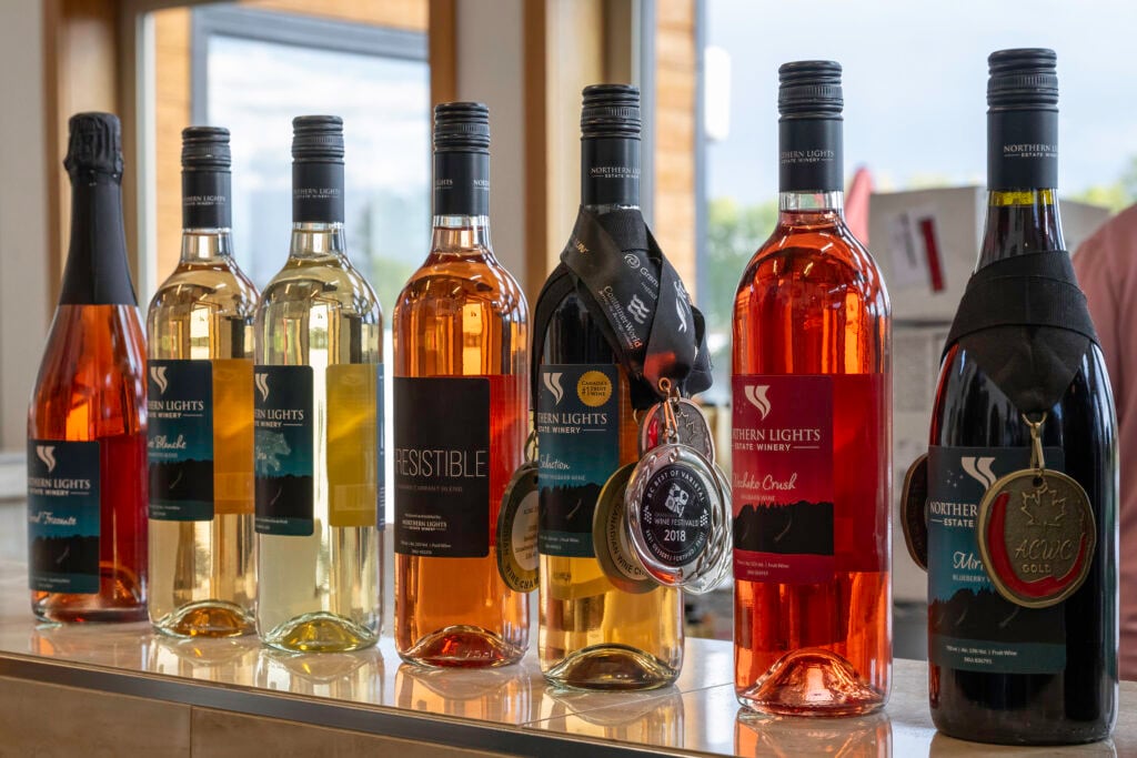 Bottles of wine lined up on a counter