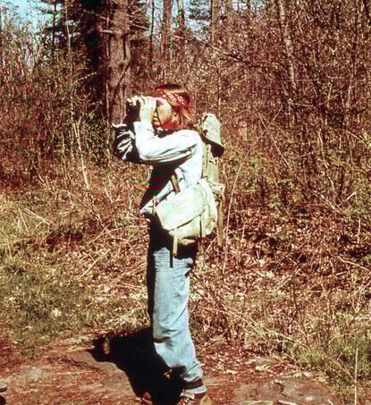 A man looking through binoculars in Ottawa in the fall of 1977.