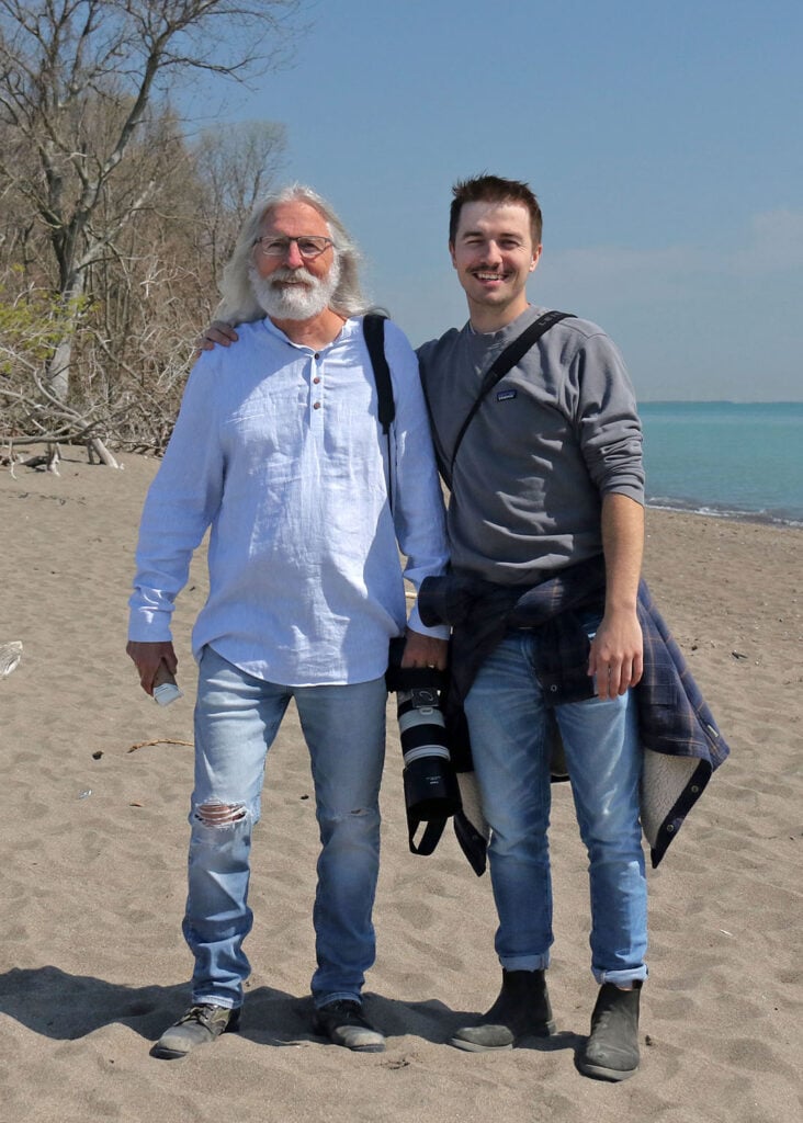 Bruce Di Labio and his son on the beach at Point Pelee National Park