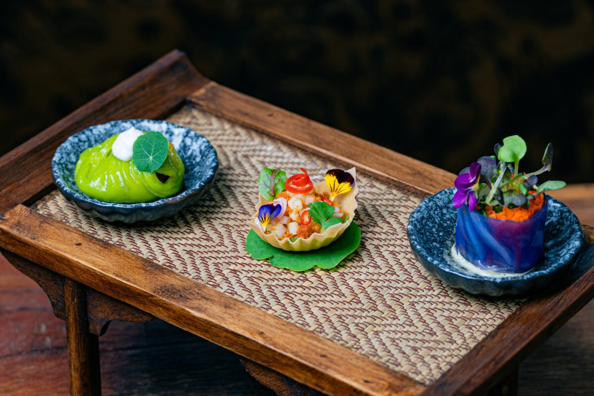 Goodbye, cucumber sandwiches. Hello, khao kriap pak mo, samosa rolls and pistachio maamoul!